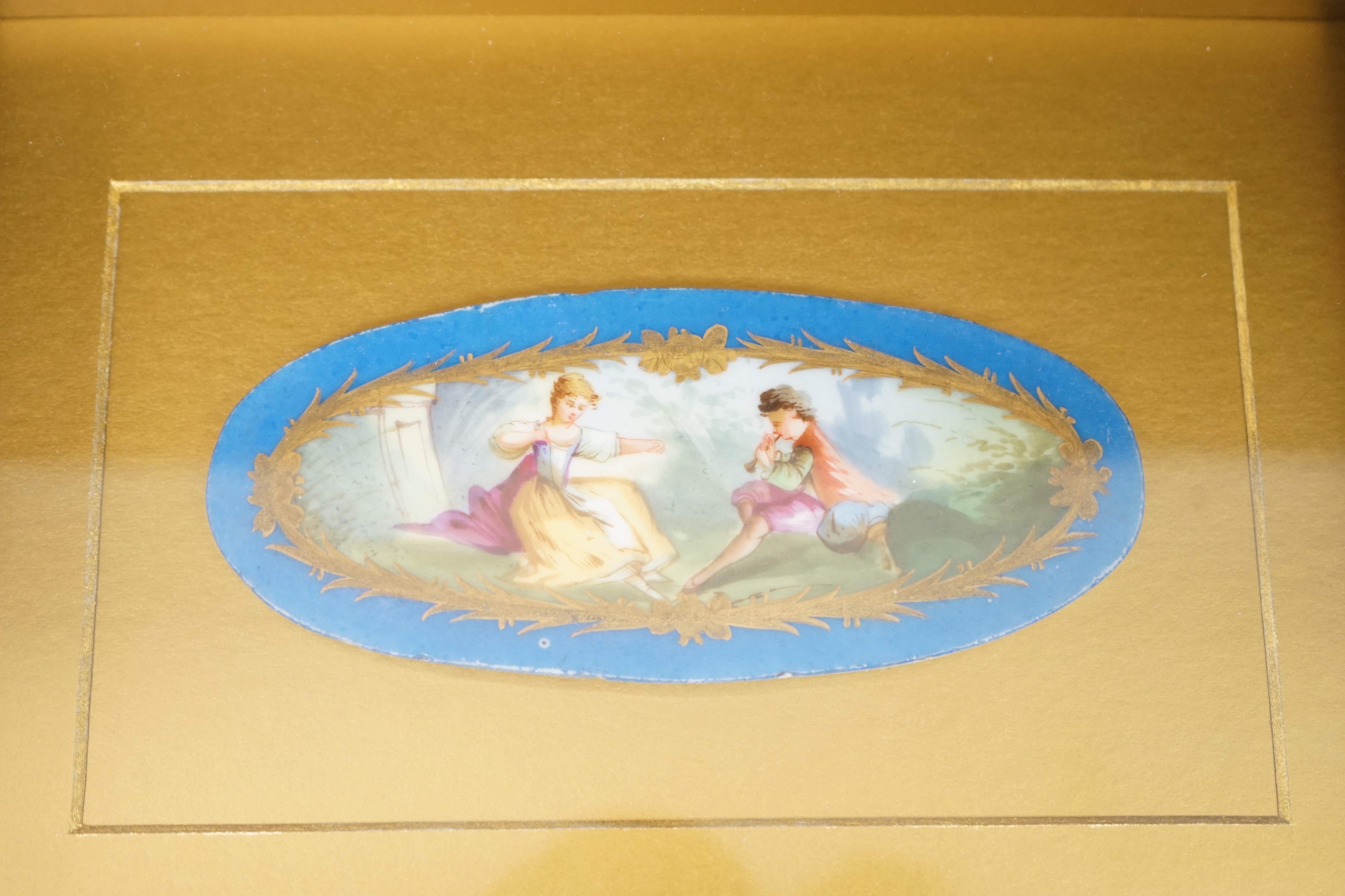 A pair of framed Sevres style porcelain oval plaques and a papier mache panel, inscribed verso and dated 1797, pair 26cm x 18cm